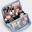 Borsa da viaggio portatile per articoli da toilette con fascia per il manico del bagaglio e scomparti multipli